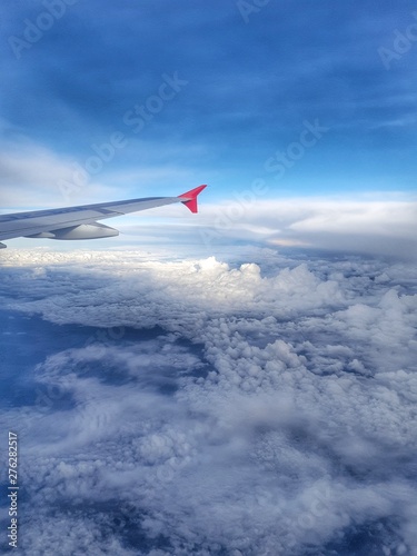 Plane wing above the clouds