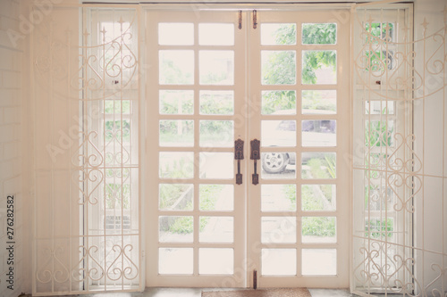 Modern bright white wood door. interior in cafe