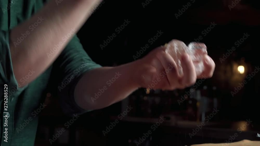 Bartender stabs the ice Bartender stabs the ice