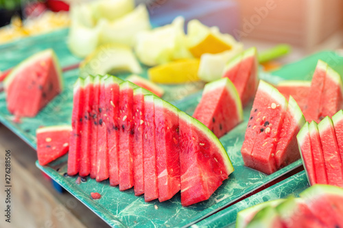 Wallpaper Mural Fresh tasty juicy sliced watermelon and melon on tray outdoors Torontodigital.ca