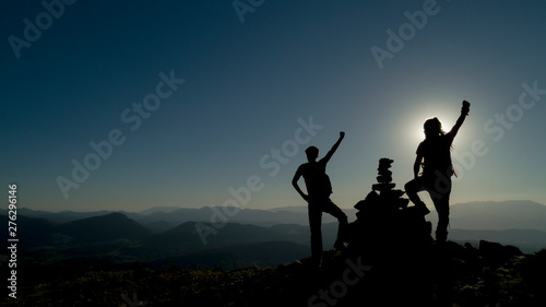 powerful climbers reaching the peaks together