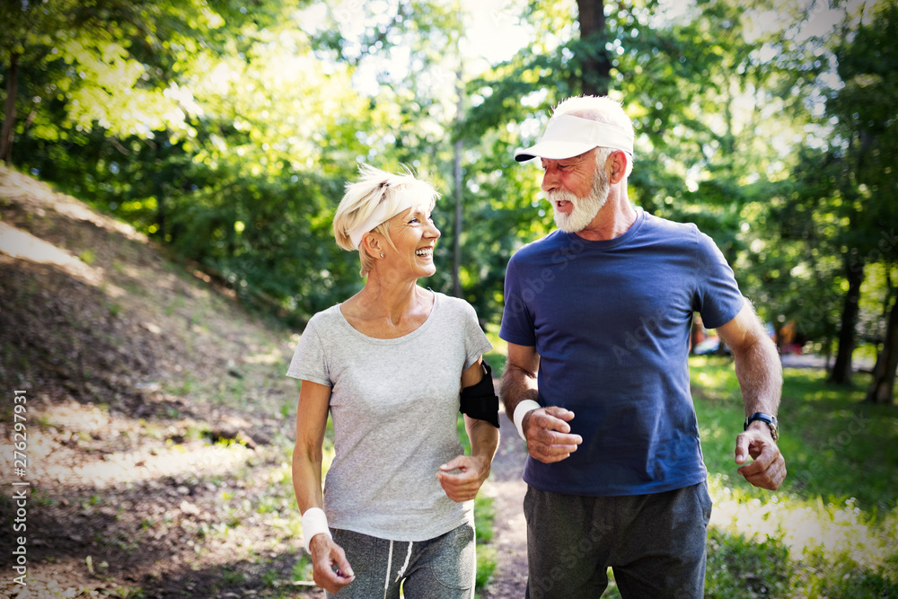Beautiful sporty mature couple styaing fit with sport Beautiful sporty mature couple styaing fit with sport