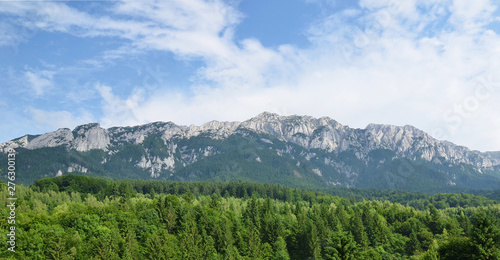 Panoramic view limestone mountain ridge of Piatra Craiului Mountains, view from Plaiul Foii touristic area, Brasov County, Romania © warmcolors