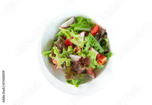 Fresh vegetable salad in white bowl on white background