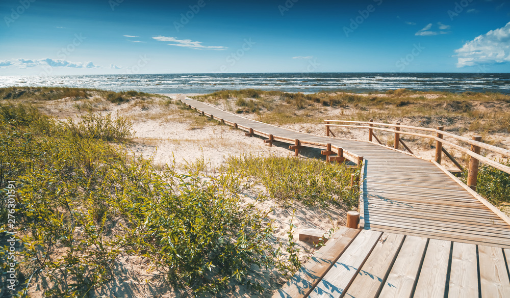 Wooden path to the Baltic Sea, the beauty of northern nature
