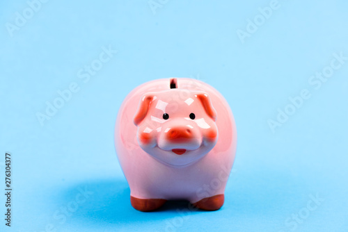 Credit debt. money saving. piggy bank on blue background. planning budget. income management. financial problem. Bankruptcy and debt. Pay for debt. Rich and successful