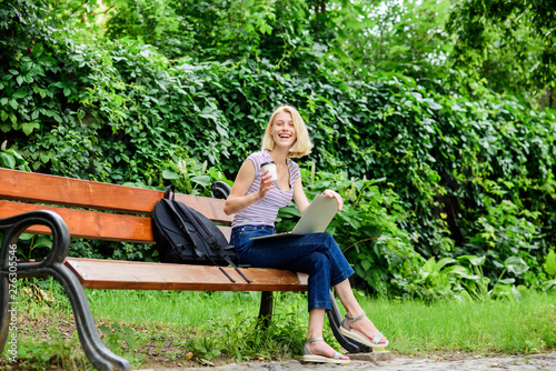 Enjoying university life. girl work on laptop. summer online. Morning chart. girl drink coffee to go. Relax in park. modern woman with computer outdoor. Pretty woman drinking takeaway coffee