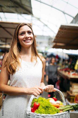 Young woman shopping healthy food on the market