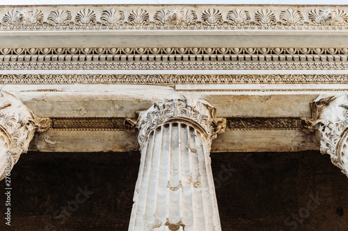 Detail of entablature and columns from The Temple of Hadrian, in Rome, Italy. photo