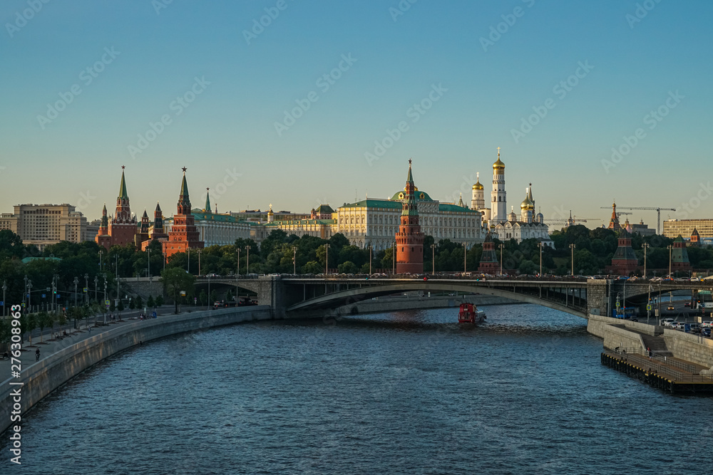 View of the Kremlin from the Patriarchal Bridge at sunset. Patriarshy Bridge - a pedestrian bridge across the Moscow River in the city center View of the Kremlin from the Patriarchal Bridge at sunset. Patriarshy Bridge - a pedestrian bridge across the Moscow River in the city center