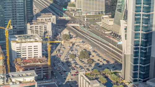 Aerial view of traffic on Business Bay with parking timelapse.
