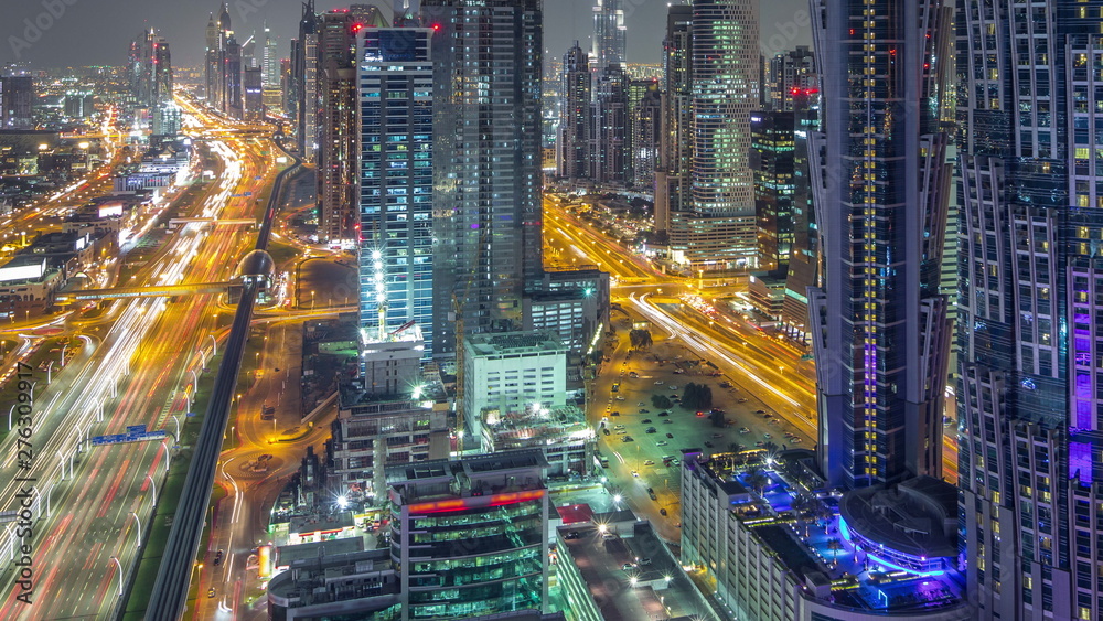 Aerial view to traffic on Sheikh Zayed road and skyscrapers on Dubai downtown night timelapse, Dubai, United Arab Emirates