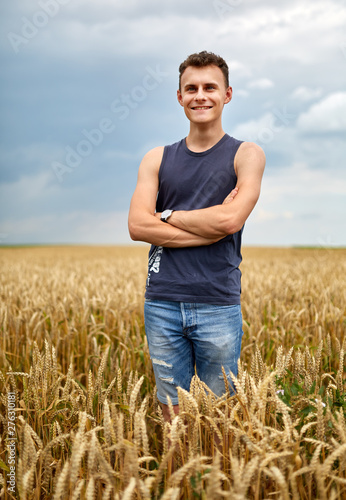 Young farmer in wheat field © Xalanx