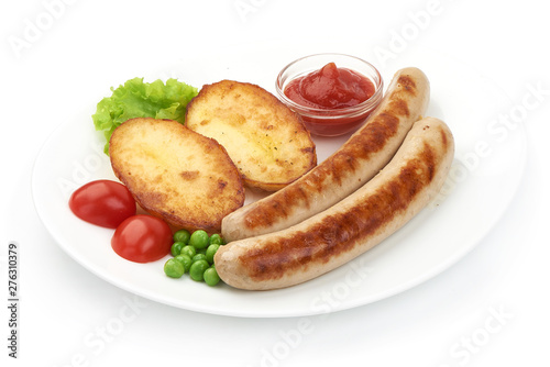 Grilled Thuringer Rostbratwurst sausages with baked potatoes, close-up, isolated on white background