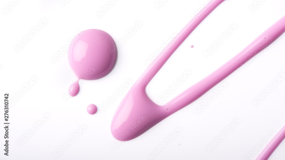 Pink nail polish drips on a white background.