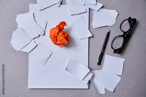 Inspiration, insight or good idea concept: a crumpled piece of orange paper photo