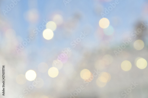 Bokeh abstract texture. Beautiful christmas background in light blue colors. Defocused