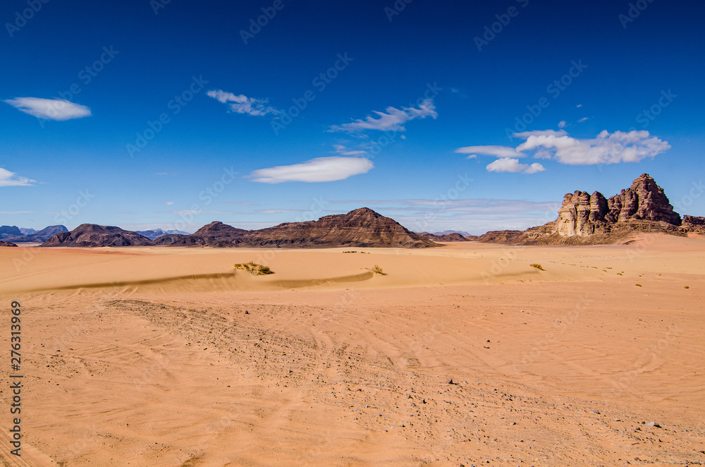 Desert with sandstone and granite rock in shape of boat in Wadi Rum in Jordan Desert with sandstone and granite rock in shape of boat in Wadi Rum in Jordan