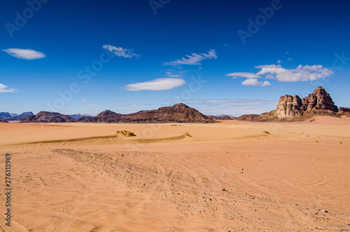 Desert with sandstone and granite rock in shape of boat in Wadi Rum in Jordan