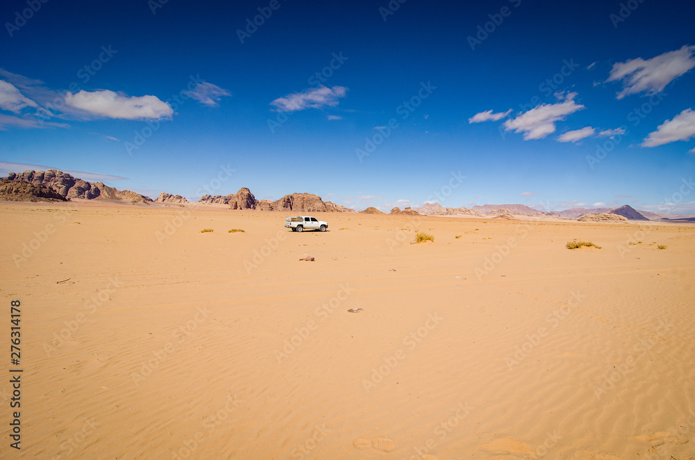 Desert with sandstone and granite rock in shape of boat in Wadi Rum in Jordan