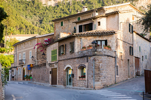Beautiful view of old mountain village Deia in Mallorca on a sunny day. Deia traditional stone village in Majorca Tramuntana mountain © romeof