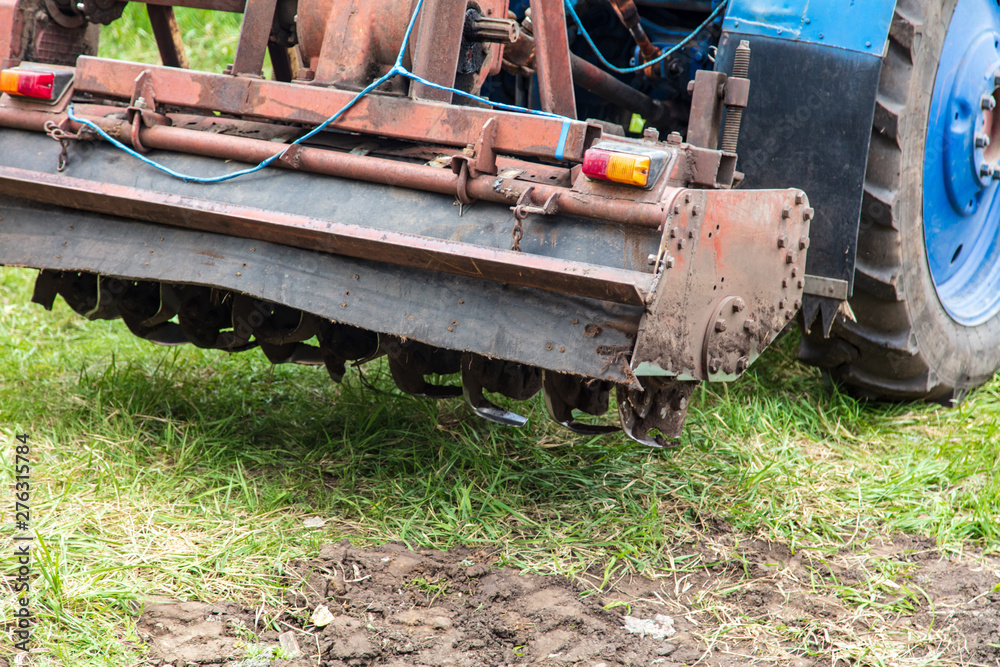 Tractor plowing soil in spring Tractor plowing soil in spring