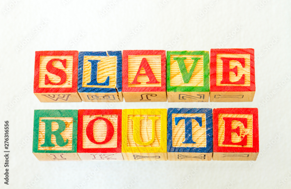 The term slave route visually displayed on a clear background using colorful wooden toy blocks image in landscape format