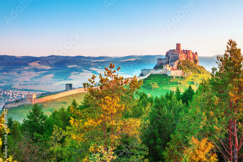 Colorful sunrise on Spis Castle, UNESCO heritage in Slovakia