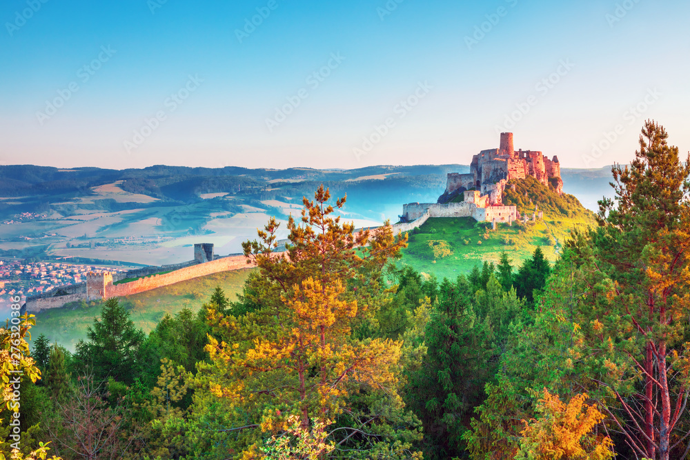 Colorful sunrise on Spis Castle, UNESCO heritage in Slovakia