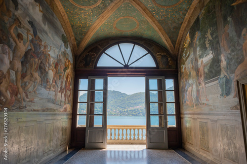 Doorway to balcony with distant view of Como Villa Carlotta Tremezzo, Como Lake, Italy. photo