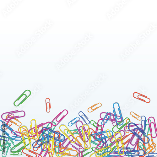 Heap of realistic colorful paper clips isolated on white background. Design element for banner, office or school supplies. Tools for education and work. Bottom border with copy space..