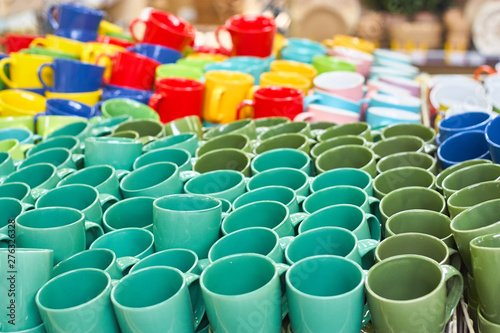Many colorful empty ceramic cups.