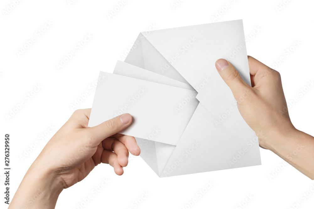Hands pulling two blank sheets of paper (tickets, flyers, invitations, coupons, banknotes, etc.) out a white envelope, isolated on white background