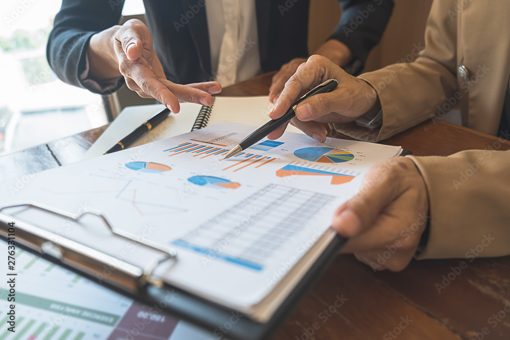 Business team brainstorming and discussing with financial data and report graph. Teamwork meeting working concept. Business team brainstorming and discussing with financial data and report graph. Teamwork meeting working concept.