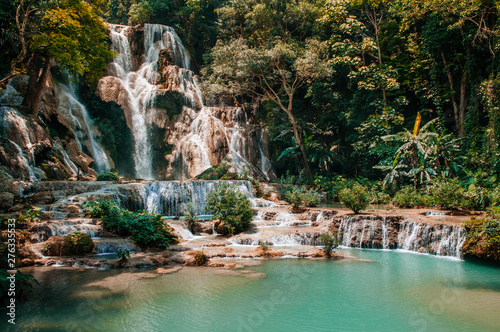 Fototapeta Naklejka Na Ścianę i Meble -  Blue water pond Kuang Si waterfall in Luang Prabang, Laos during summer season.