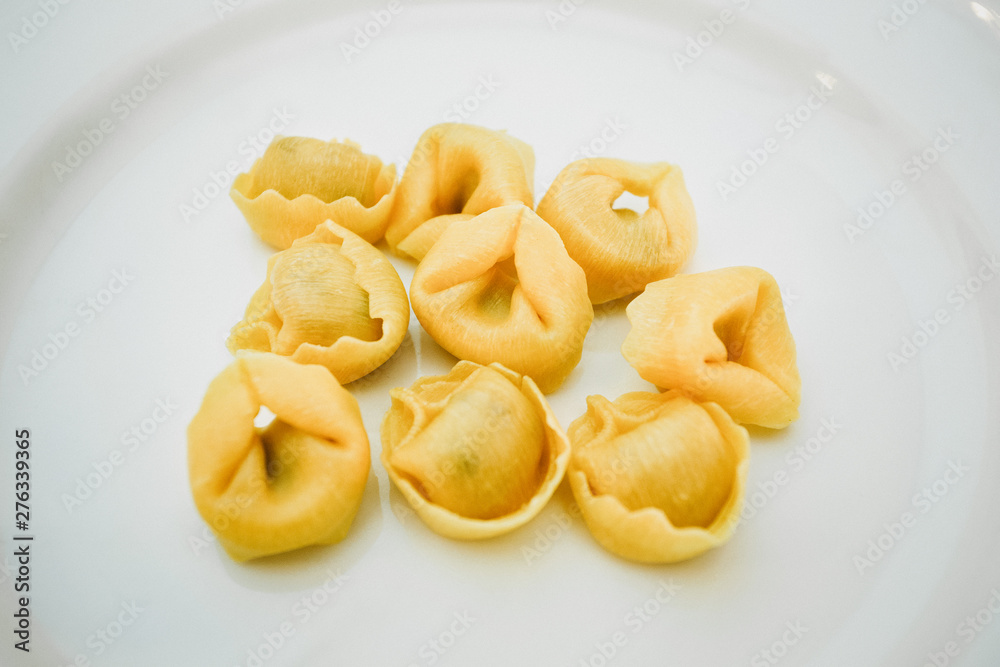Italian traditional tortellini pasta over white plate. Healthy diet. Mediterranean cuisine.