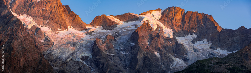 Sunset on the Meije and Rateau glaciers (panoramic) in the Ecrins National Park. France, Hautes-Alpes (05), La Grave, European Alps