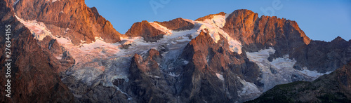 Sunset on the Meije and Rateau glaciers (panoramic) in the Ecrins National Park. France, Hautes-Alpes (05), La Grave, European Alps