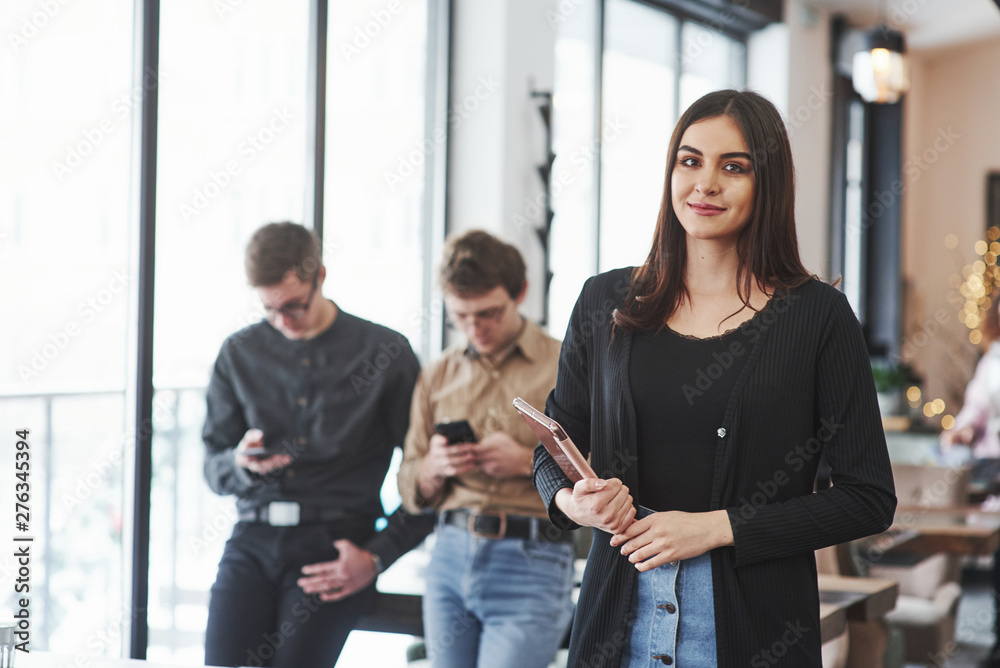 Obraz premium Conception of business and start up. Group of students in eyewear standing in the learning room at daytime