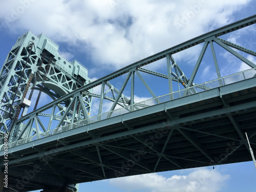 Robert F. Kennedy Bridge with blue sky and cloud view from the river, New York City. © Voranut