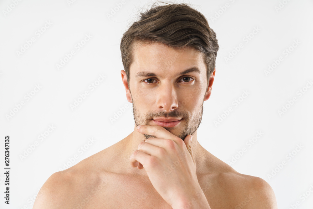 Close up of a handsome young shirtless man isolated Close up of a handsome young shirtless man isolated