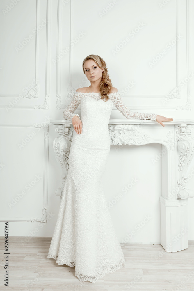 in full growth. beautiful bride in a chic white dress. in full growth. beautiful bride in a chic white dress.