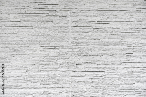 White classic stone brick are arranged to pattern on the wall for beautiful minimal and simple background.