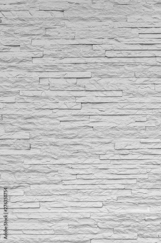 White classic stone brick are arranged to pattern on the wall for beautiful minimal and simple background.