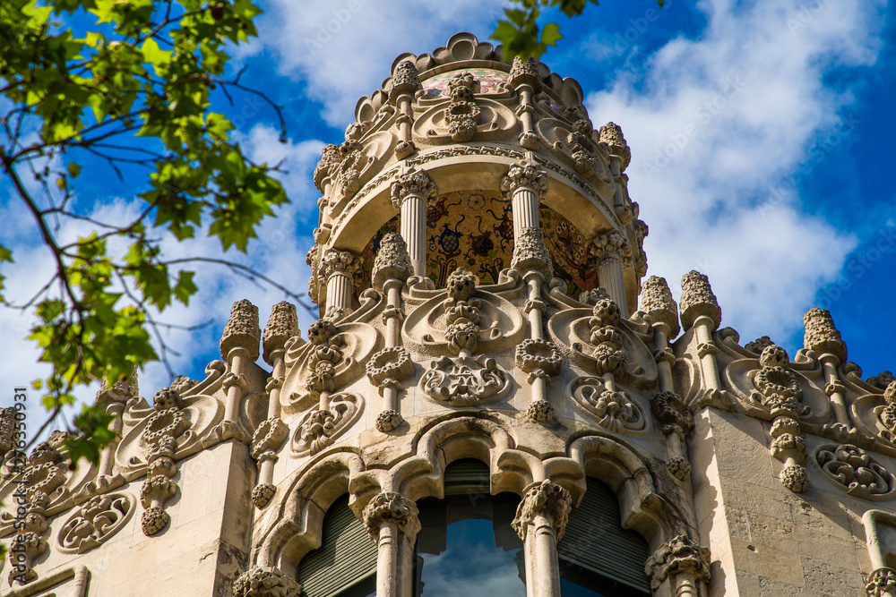 Obraz premium BARCELONA, CATALONIA - APRIL 2019: Passeig de Gracia in Barcelona, Catalonia. It one of major avenue in city. Located in the Eixample district. Shopping and business areas