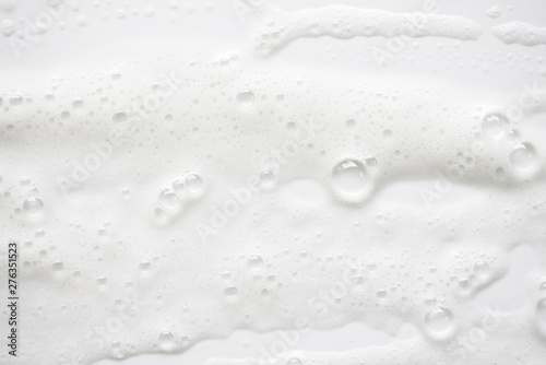 Abstract background white soapy foam texture. Shampoo foam with bubbles