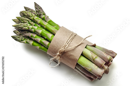 An edible, raw stems of asparagus isolated on white background.