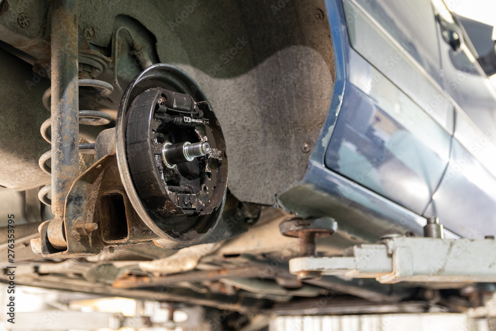 Fototapeta premium Car repair, rear drum brake repair