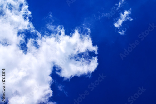 Soaring clouds in the bright blue sky