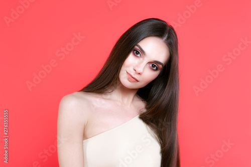 Sexy young woman on pink background
